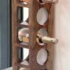 Eco-Friendly Solid Wood Bottle Rack Elegant Wine Display Shelf for Wall or Tabletop Use Handmade Quality Available for Sale